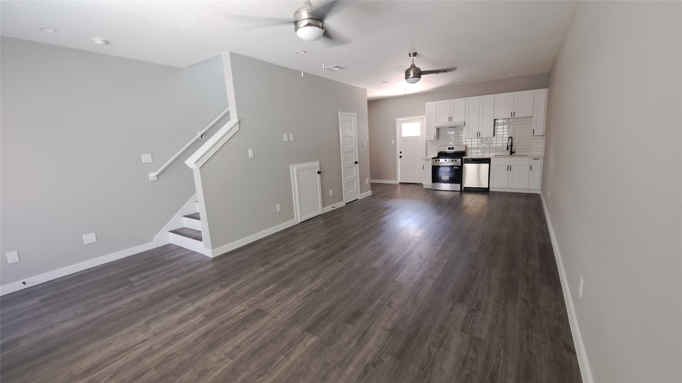 9806 Fillmore Street, Unit B Houston, TX 77029 - Photo 3 of 9 wooden floor in an empty room with a window