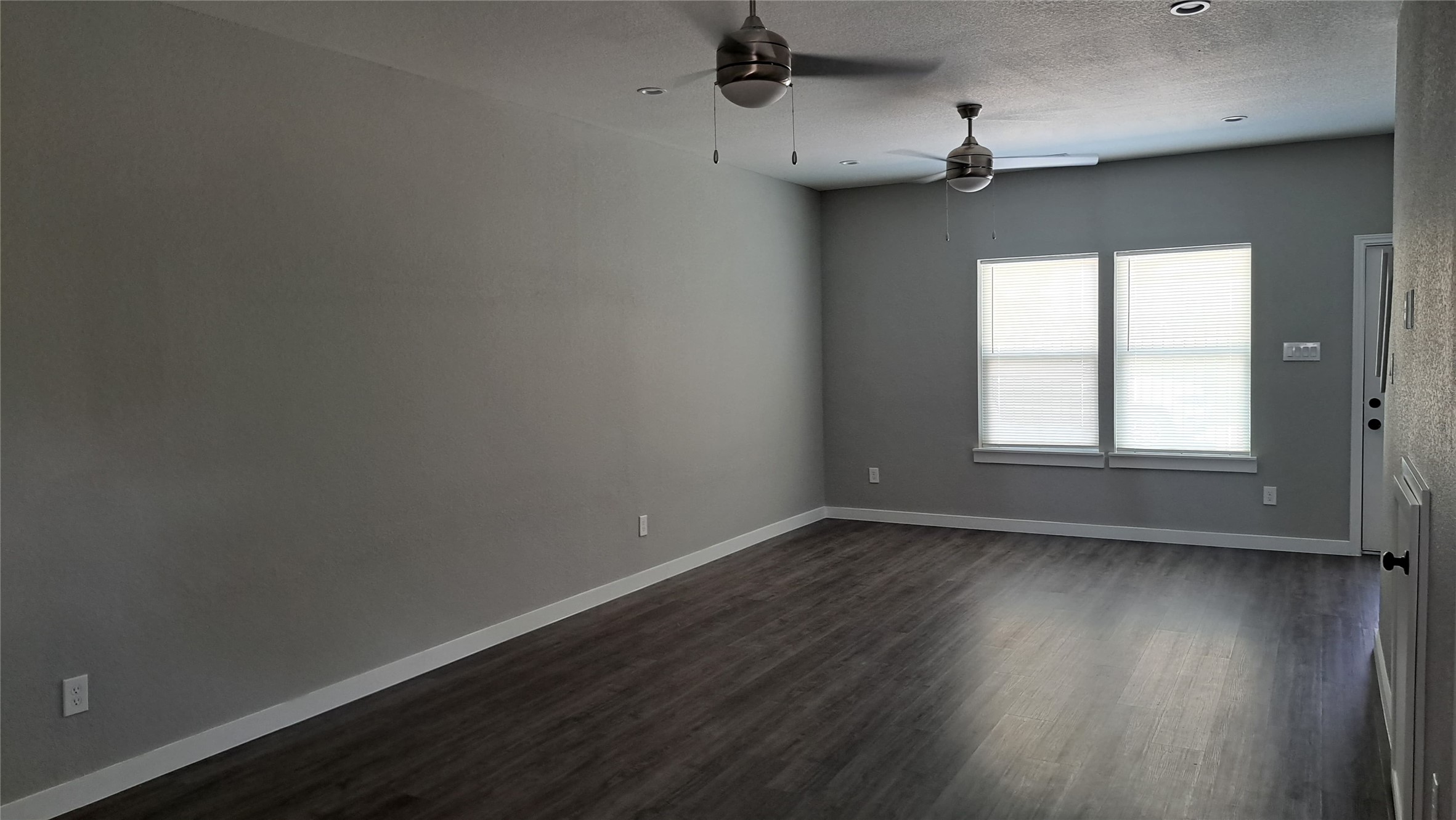 9806 Fillmore Street, Unit B Houston, TX 77029 - Photo 4 of 9 wooden floor in an empty room with a window
