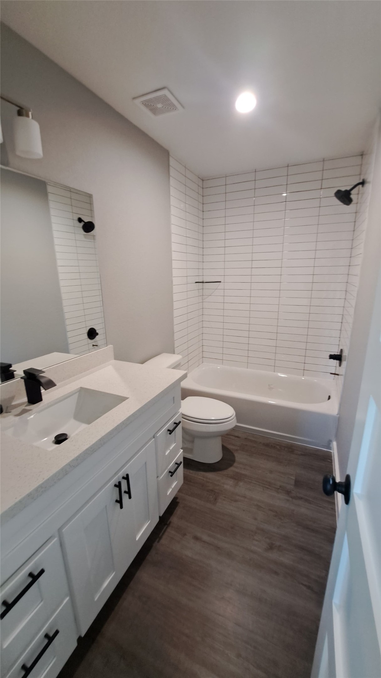 9806 Fillmore Street, Unit B Houston, TX 77029 - Photo 8 of 9 a bathroom with a sink a toilet and shower