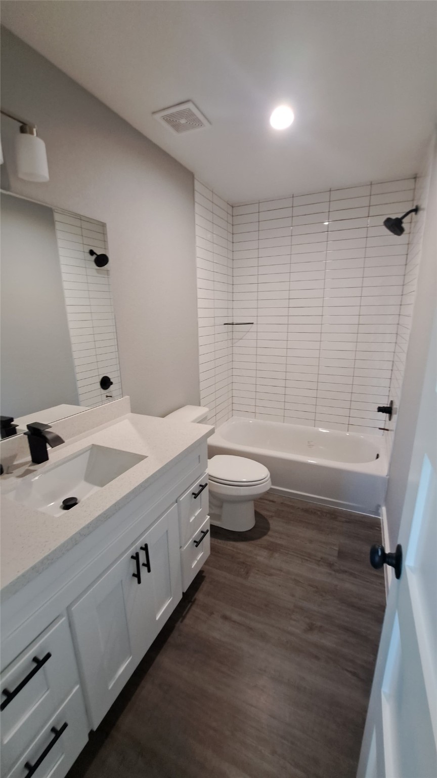 9806 Fillmore Street, Unit B Houston, TX 77029 - Photo 9 of 10 a bathroom with a sink a toilet and shower