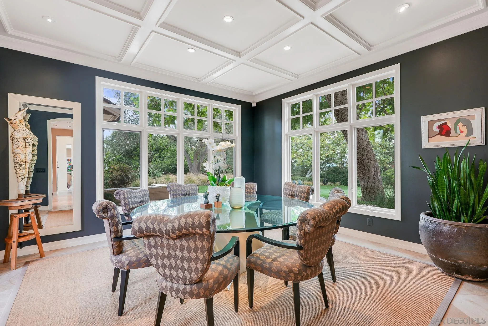 7891 Muirfield Way Rancho Santa Fe, CA 92067 - Photo 12 of 47 a dining room with furniture large windows and wooden floor