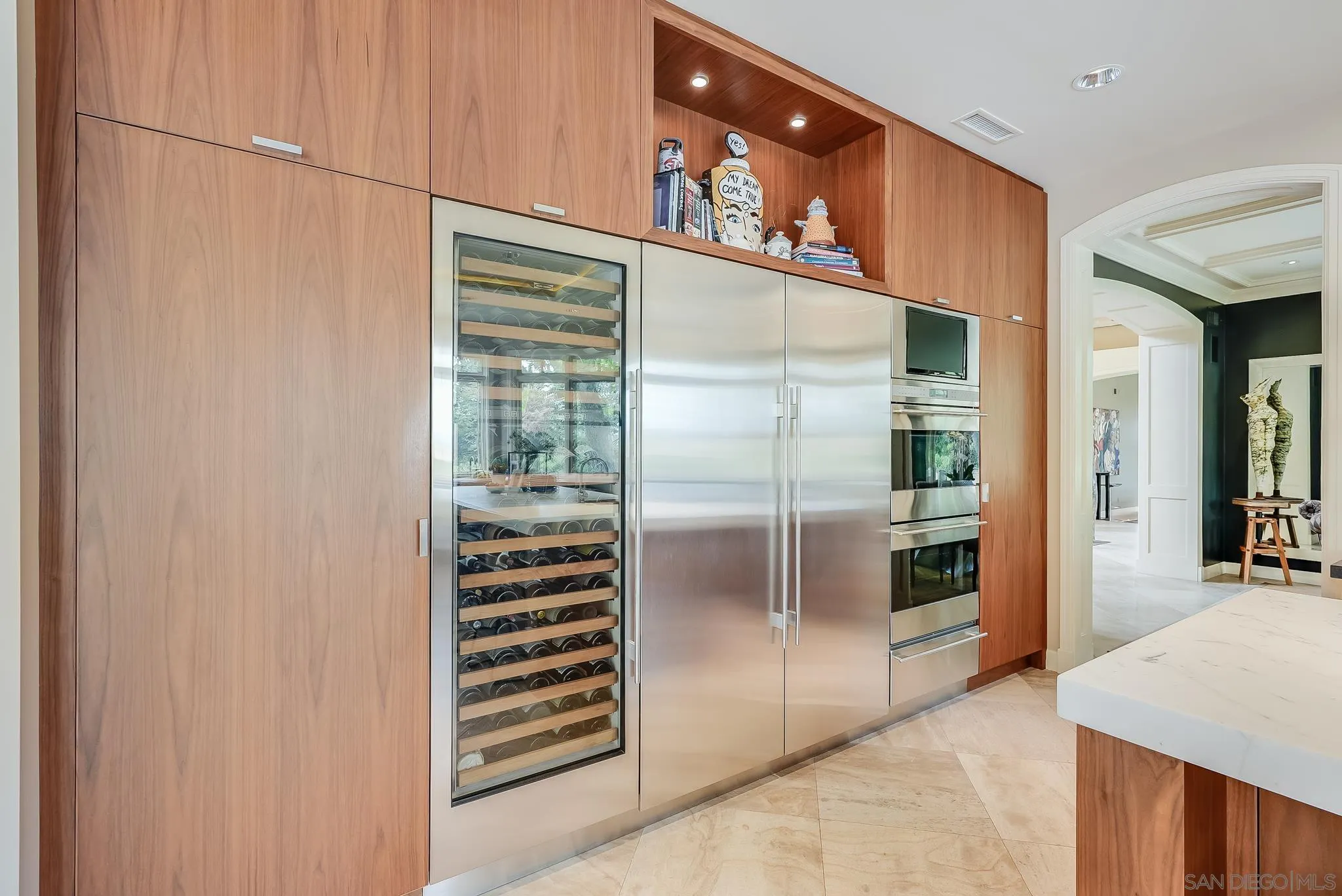 7891 Muirfield Way Rancho Santa Fe, CA 92067 - Photo 15 of 47 a kitchen with stainless steel appliances a refrigerator and a stove