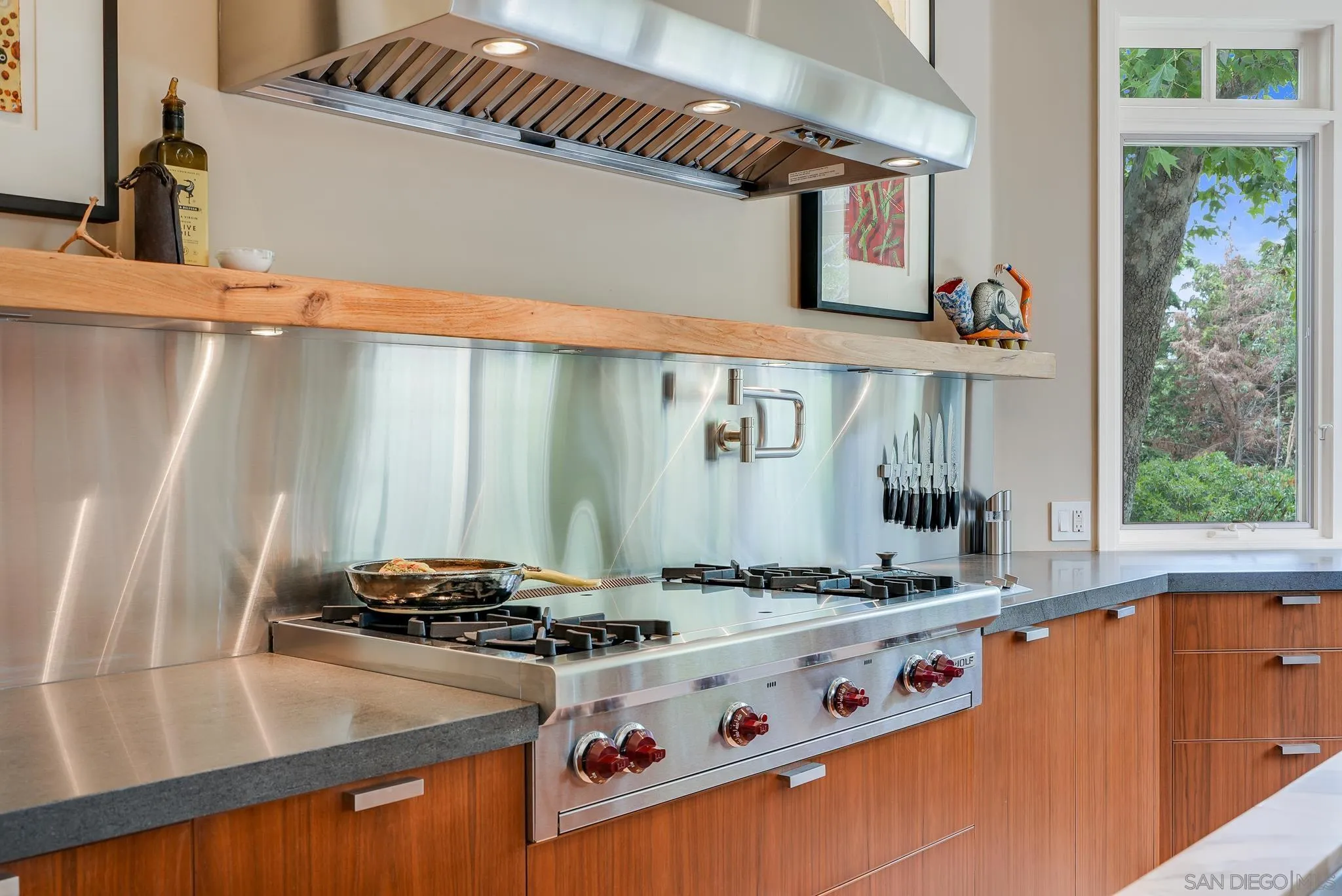 7891 Muirfield Way Rancho Santa Fe, CA 92067 - Photo 17 of 47 a white stove top oven sitting inside of a kitchen