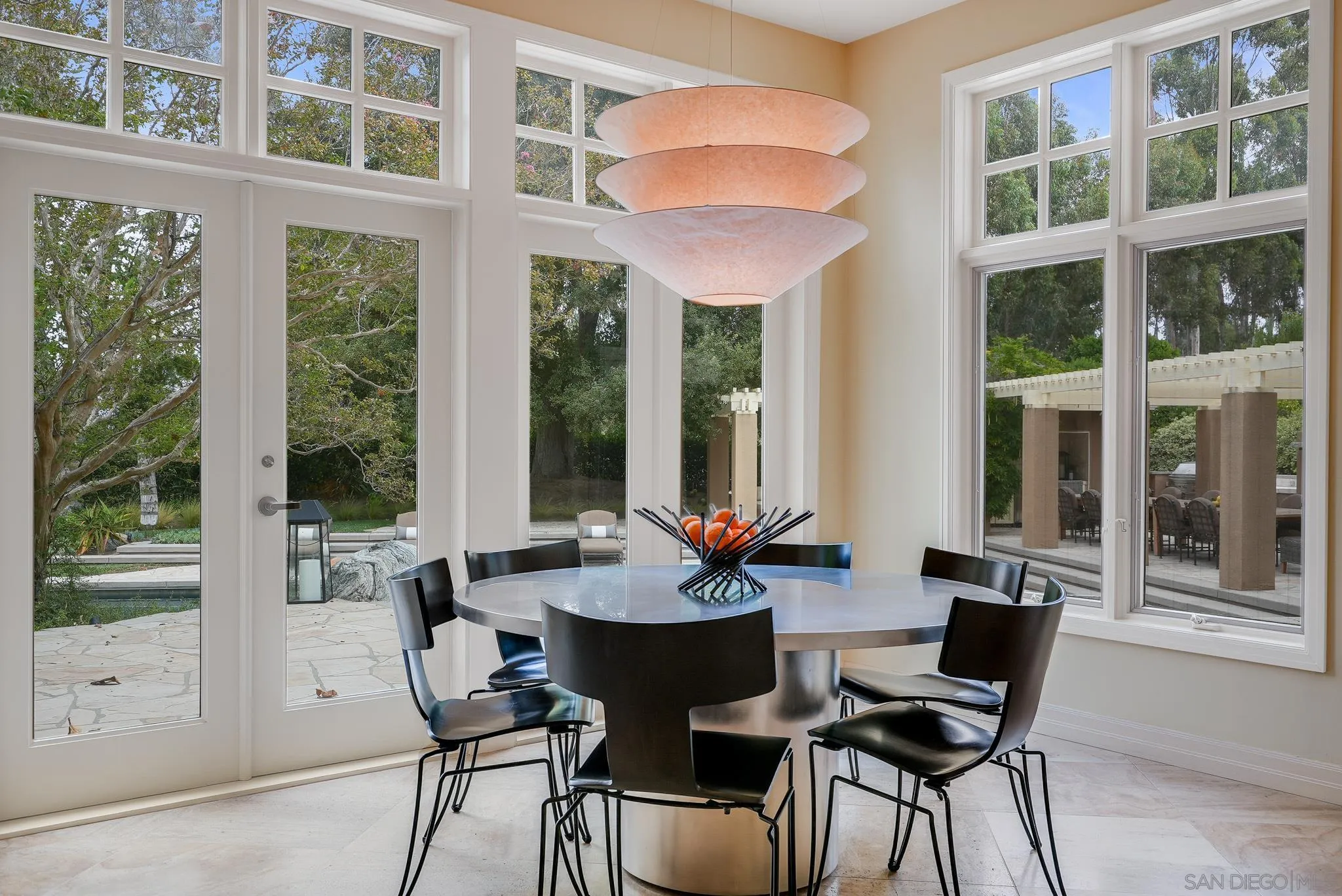 7891 Muirfield Way Rancho Santa Fe, CA 92067 - Photo 19 of 47 a dining room with furniture and large windows