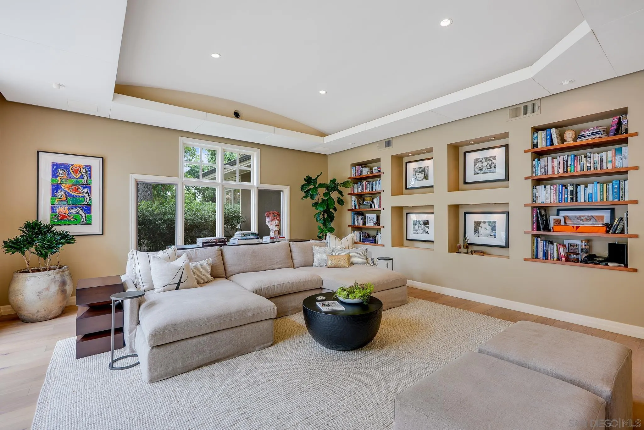 7891 Muirfield Way Rancho Santa Fe, CA 92067 - Photo 21 of 47 a living room with furniture and a book shelf