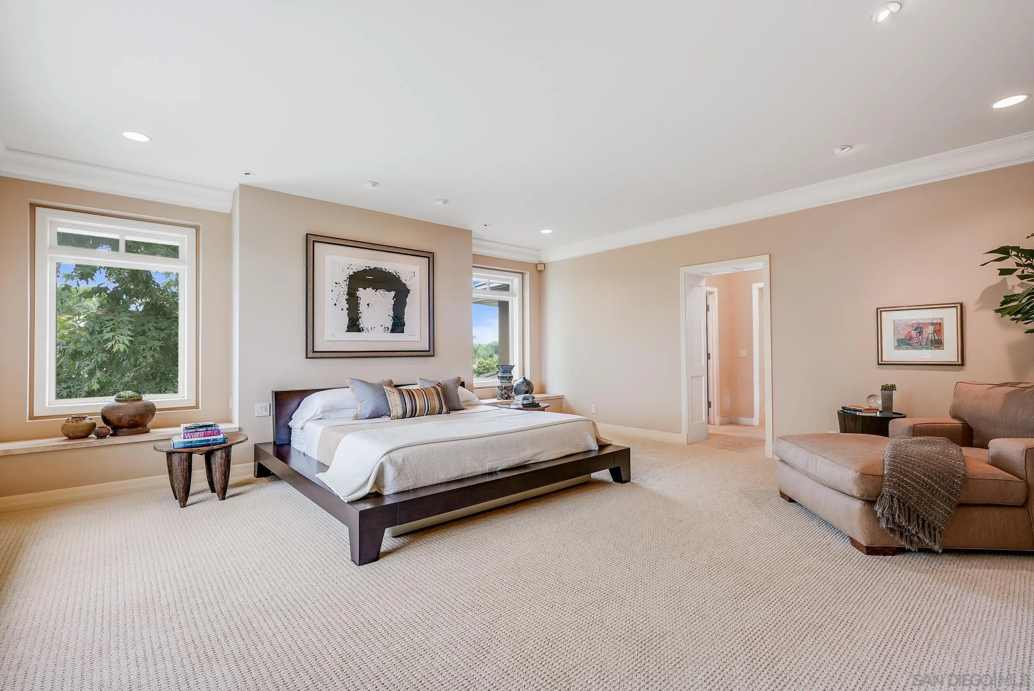 7891 Muirfield Way Rancho Santa Fe, CA 92067 - Photo 23 of 47 a spacious bedroom with a bed and glass window