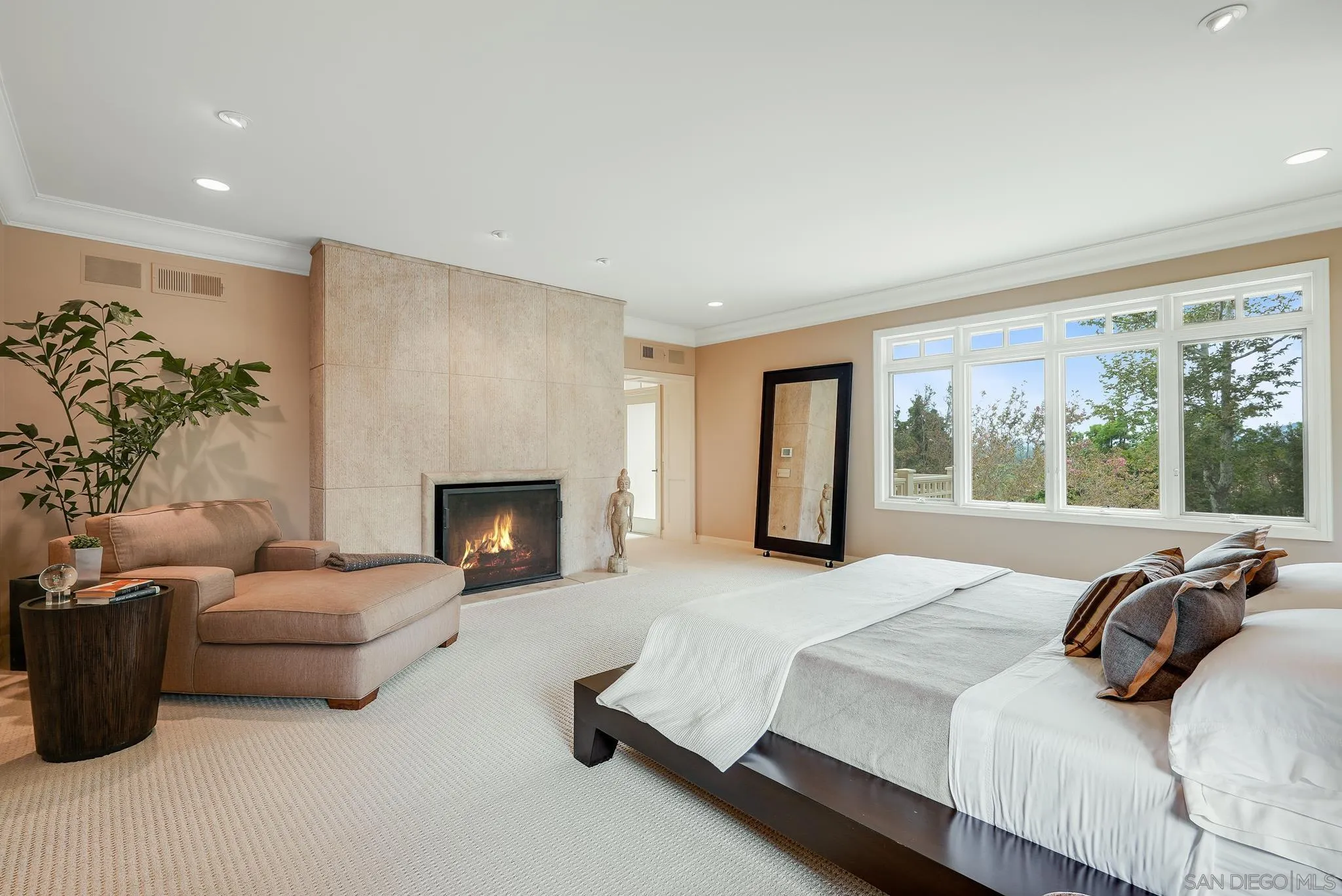 7891 Muirfield Way Rancho Santa Fe, CA 92067 - Photo 24 of 47 a spacious bedroom with a bed and a couch
