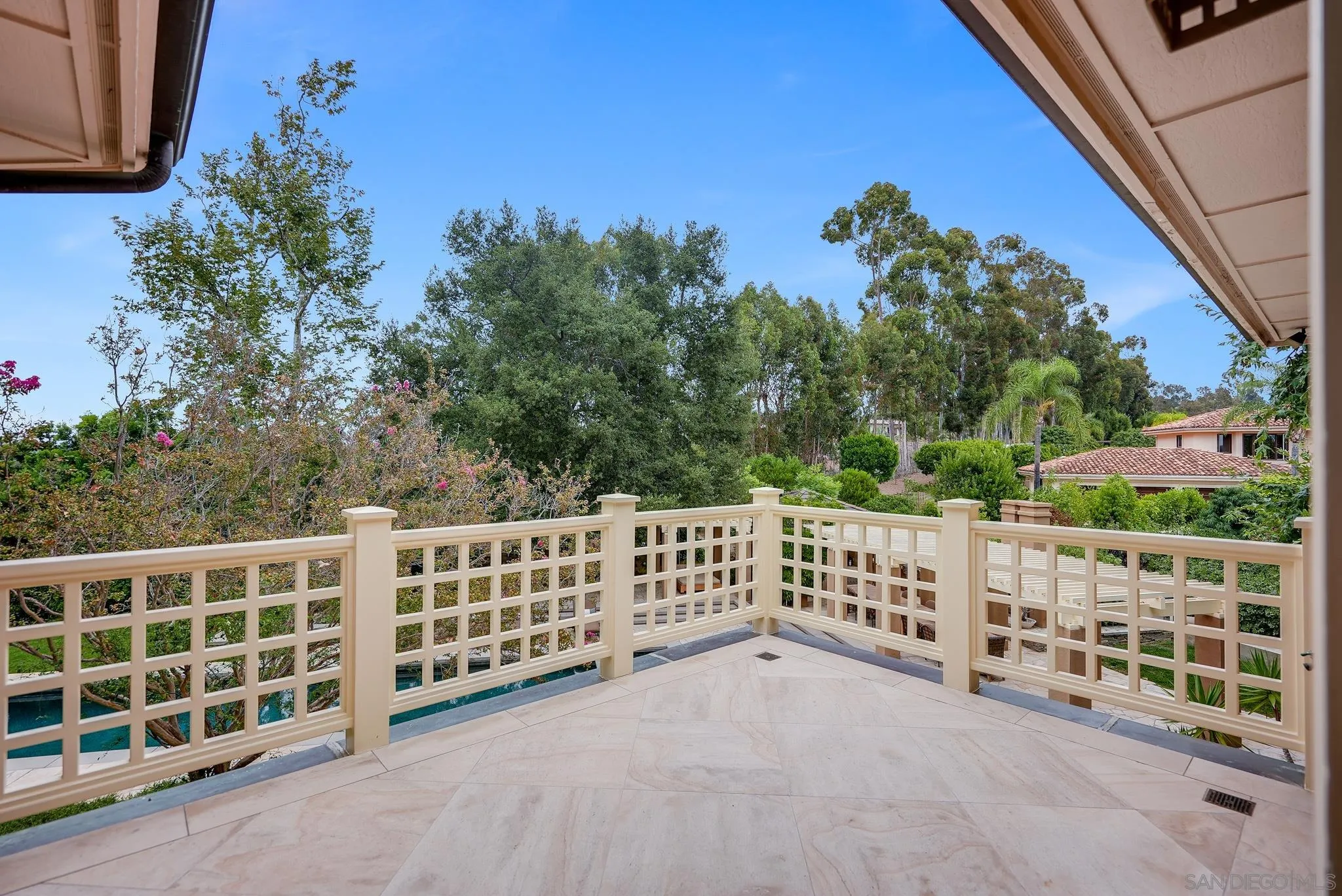 7891 Muirfield Way Rancho Santa Fe, CA 92067 - Photo 32 of 47 a view of a balcony with wooden fence