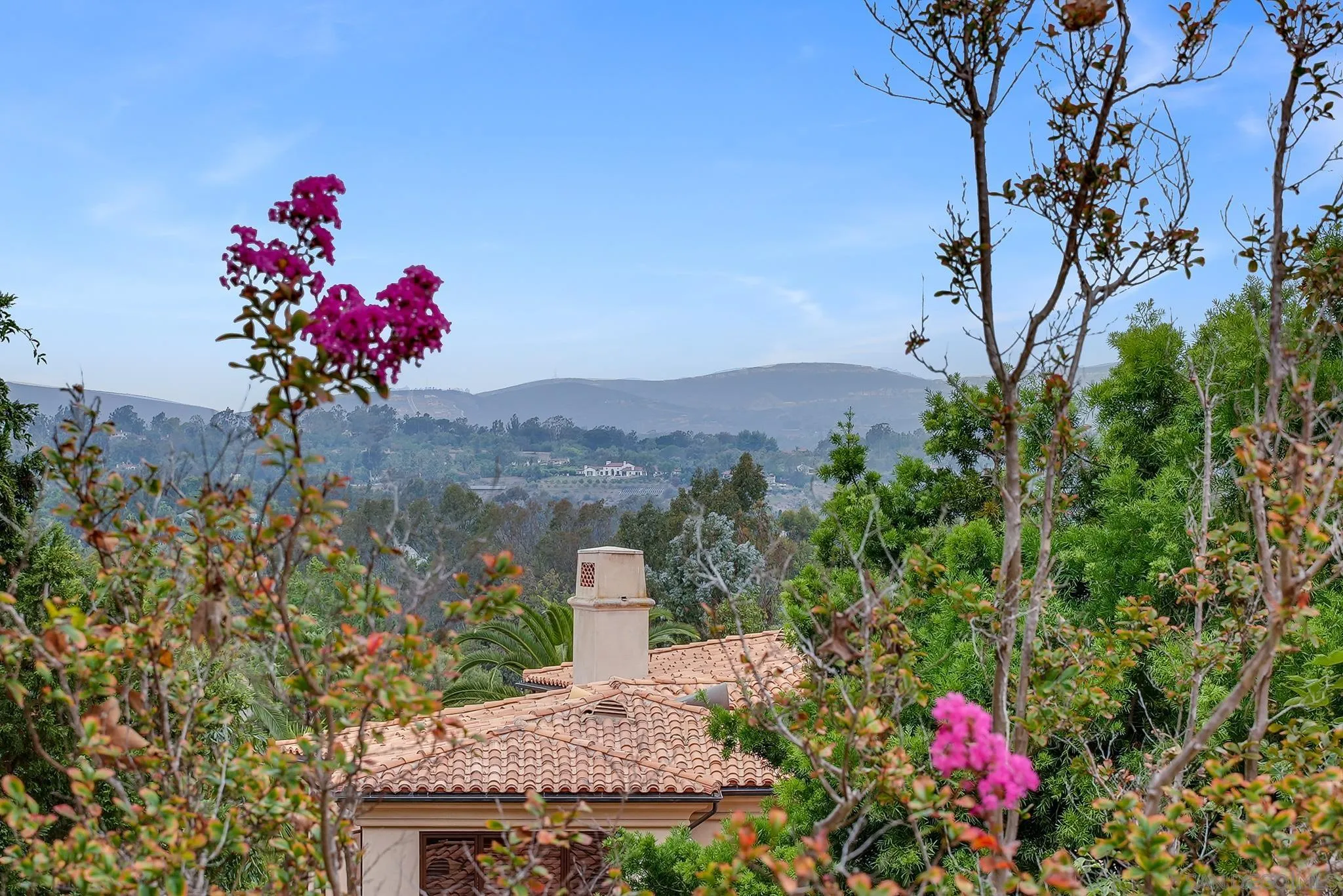 7891 Muirfield Way Rancho Santa Fe, CA 92067 - Photo 33 of 47 a view of a house with a yard and garden