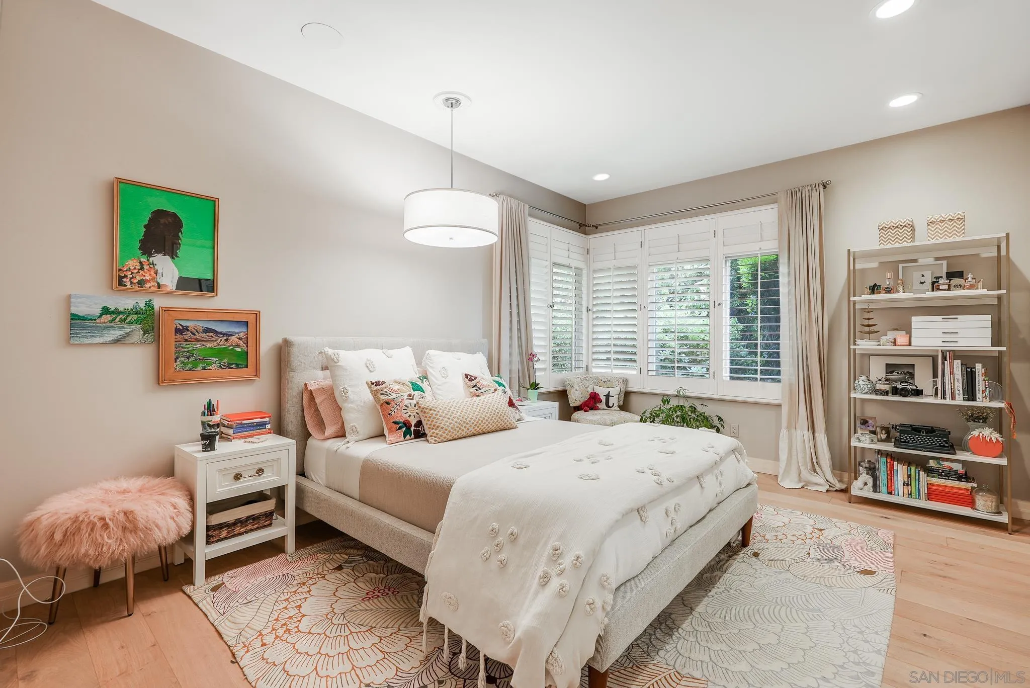 7891 Muirfield Way Rancho Santa Fe, CA 92067 - Photo 38 of 47 a bedroom with a bed and a book shelf