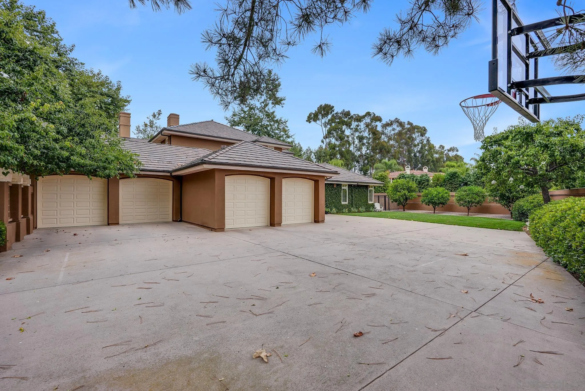 7891 Muirfield Way Rancho Santa Fe, CA 92067 - Photo 46 of 47 front view of a house with a yard and a garage