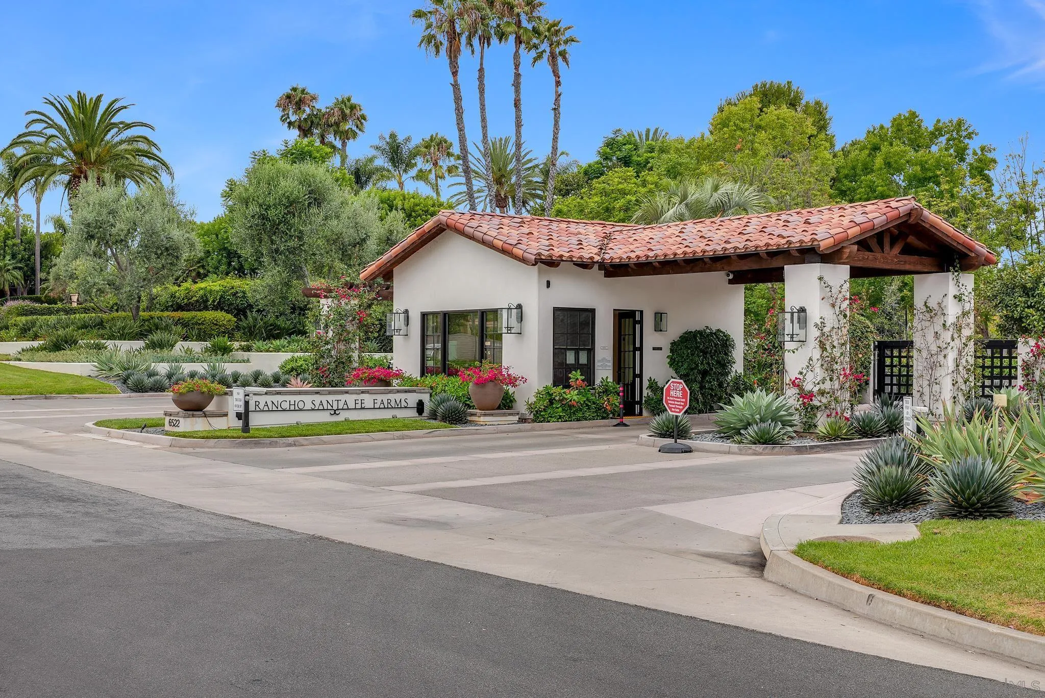 7891 Muirfield Way Rancho Santa Fe, CA 92067 - Photo 47 of 47 a view of a house with a yard and potted plants
