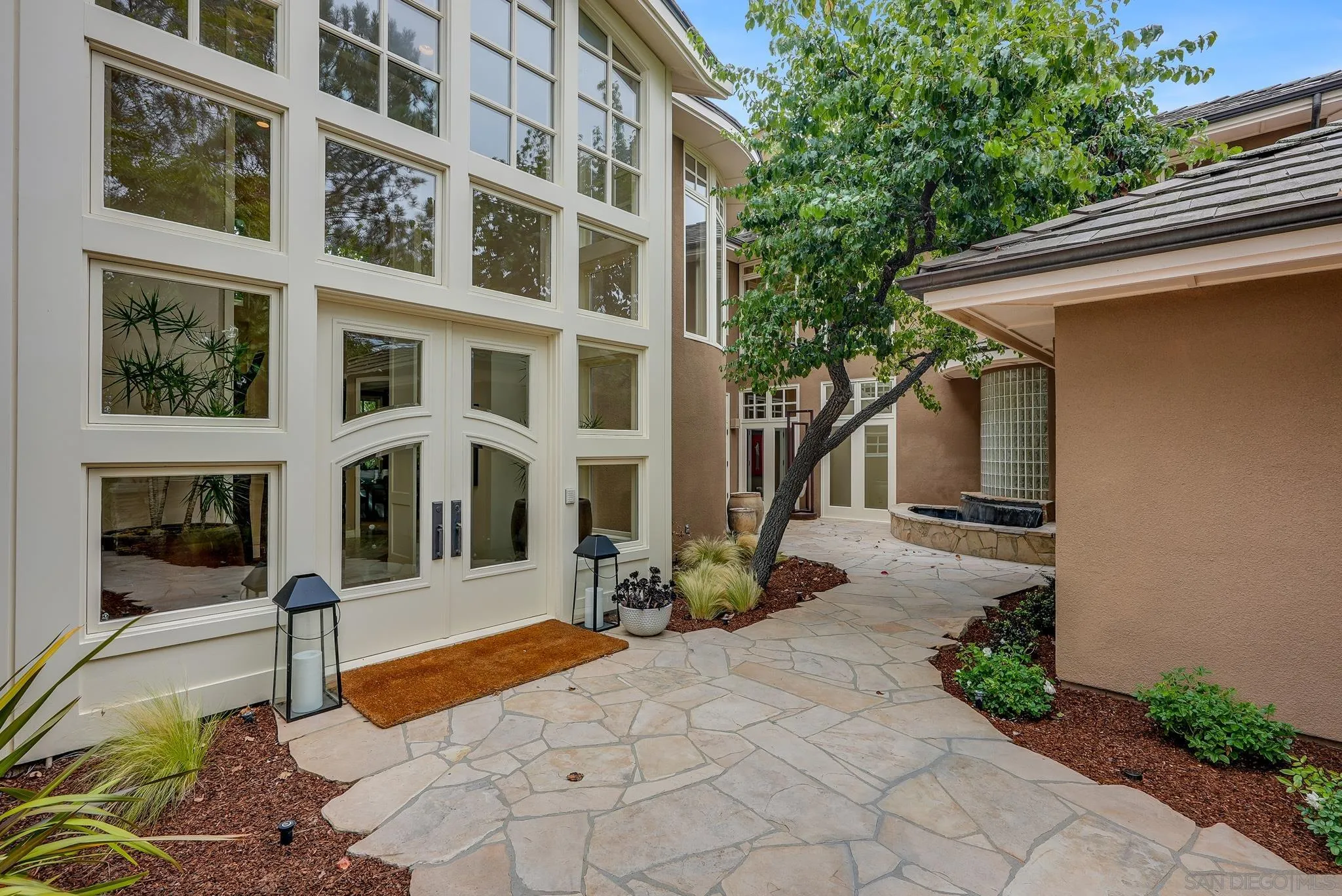 7891 Muirfield Way Rancho Santa Fe, CA 92067 - Photo 6 of 47 a front view of a multi story residential apartment building
