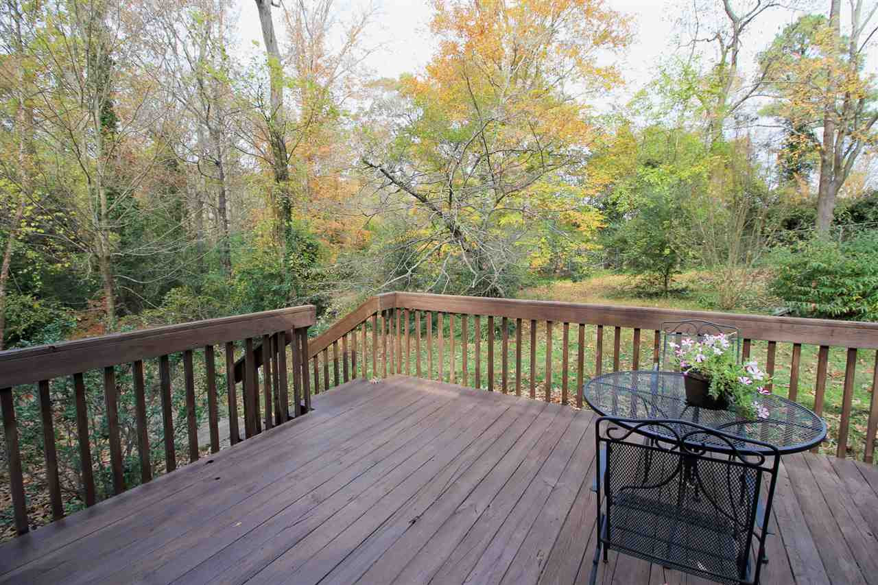 308 Lord Berkley Road Raleigh, NC 27610 - Photo 24 of 25 This home has a huge deck right outside the living room. There is plenty of room for a sofa set and for a dining set! It looks out onto your expansive back yard! on the other side of that railing is a huge fragrant gardenia! Deck / Backyard