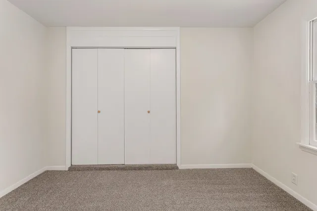 a bathroom with a sink toilet and mirror