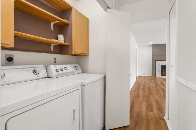a view of a room with wooden floor and small space