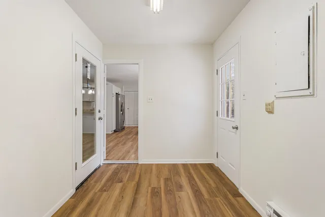 a view of a house with snow on the road