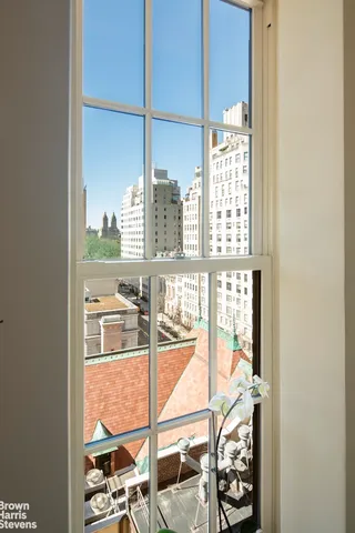 a view of a glass door with a lake view