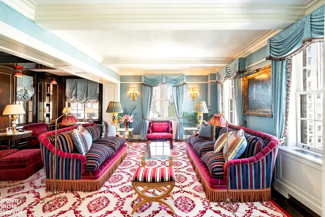 a living room with furniture lamp and rug