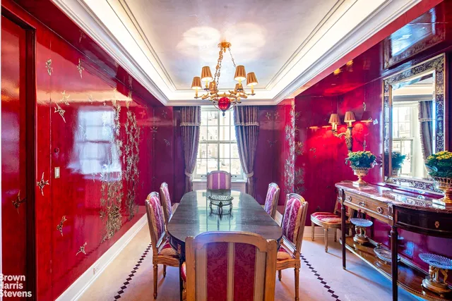 a view of a dining room with furniture and chandelier