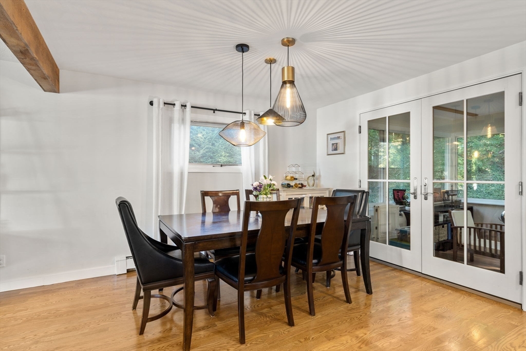 28 Woodbine Circle Needham, MA 02494 - Photo 11 of 29 a view of a dining room with furniture window and outside view