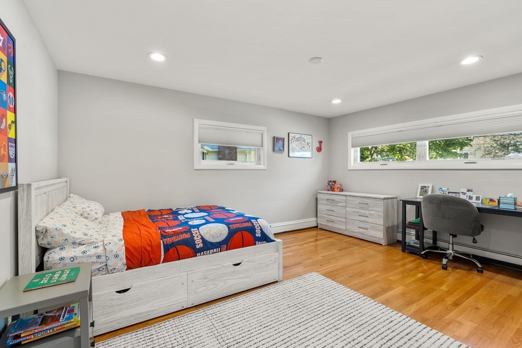 28 Woodbine Circle Needham, MA 02494 - Photo 15 of 29 a bedroom with furniture and a bed