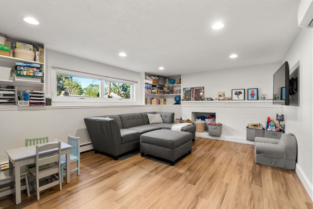 28 Woodbine Circle Needham, MA 02494 - Photo 20 of 29 a living room with furniture and a wooden floor