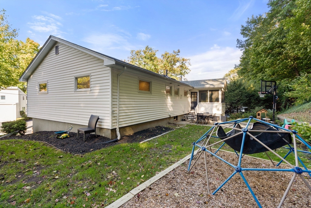 28 Woodbine Circle Needham, MA 02494 - Photo 26 of 29 a front view of a house with garden