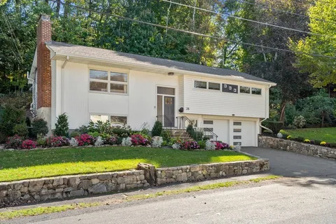 a view of a house with garden and yard