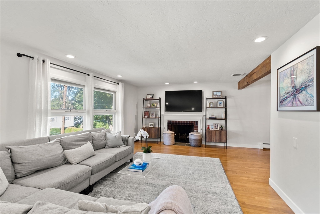 28 Woodbine Circle Needham, MA 02494 - Photo 9 of 29 a living room with furniture and a fireplace