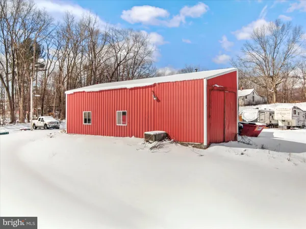 a view of a yard covered in snow