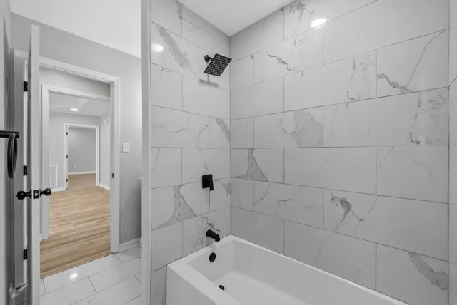 a view of a livingroom with a ceiling fan and window