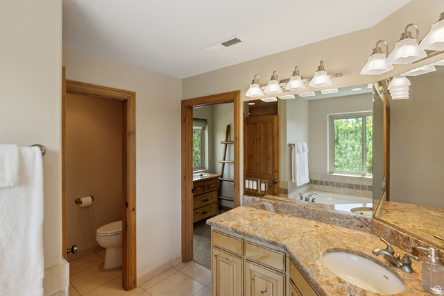 755 South Zion Ridge Drive Orderville, UT 84758 - Photo 74 of 84 Full bathroom featuring vanity, light tile patterned floors, and a bath