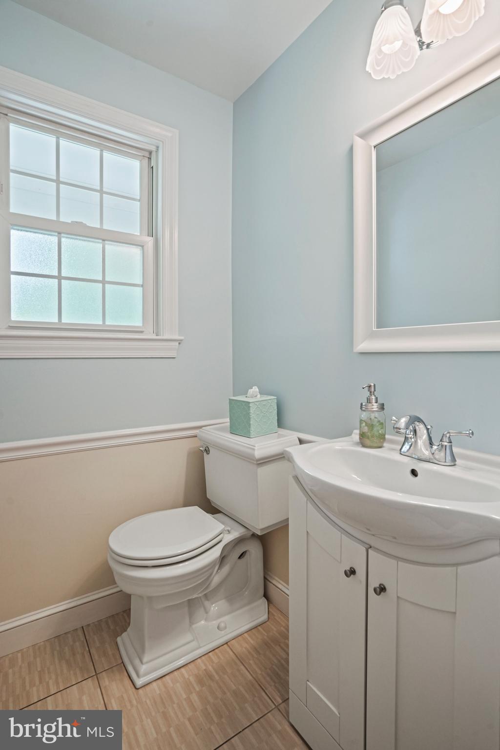 1907 Brisbane Street Silver Spring, MD 20902 - Photo 17 of 39 a bathroom with a sink toilet and window
