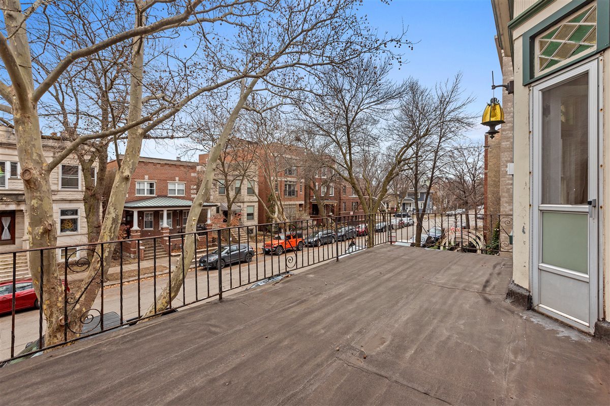 3716 North Wayne Avenue, Unit 2 Chicago, IL 60613 - Photo 11 of 17 a view of a building with a outdoor space