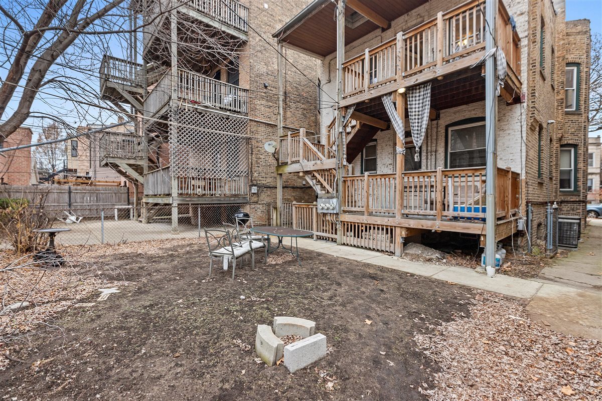 3716 North Wayne Avenue, Unit 2 Chicago, IL 60613 - Photo 17 of 17 a view of a house with a yard