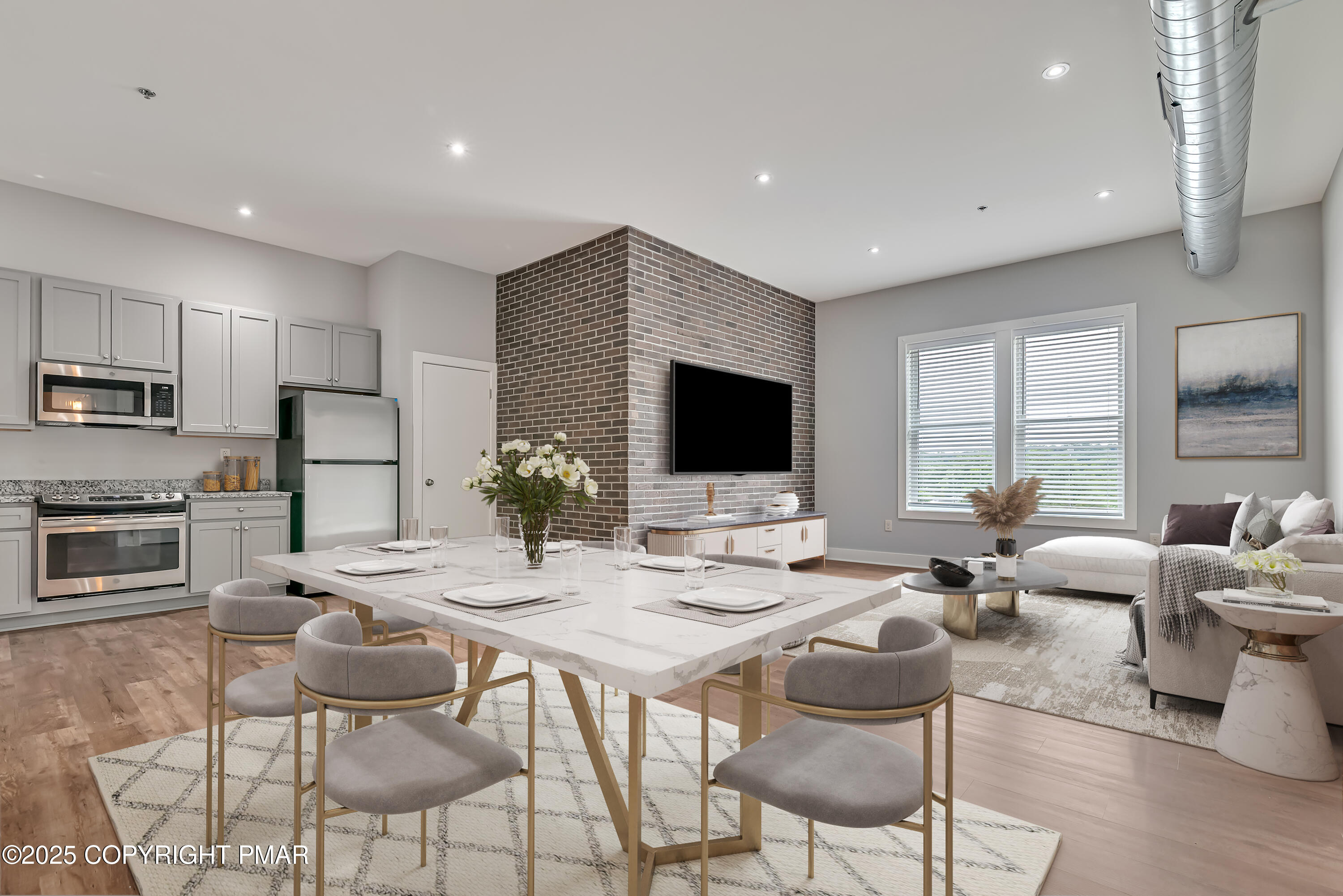 55 North Courtland Street, Unit 204 East Stroudsburg, PA 18301 - Photo 1 of 7 a outdoor kitchen with stainless steel appliances kitchen island granite countertop a sink and cabinets