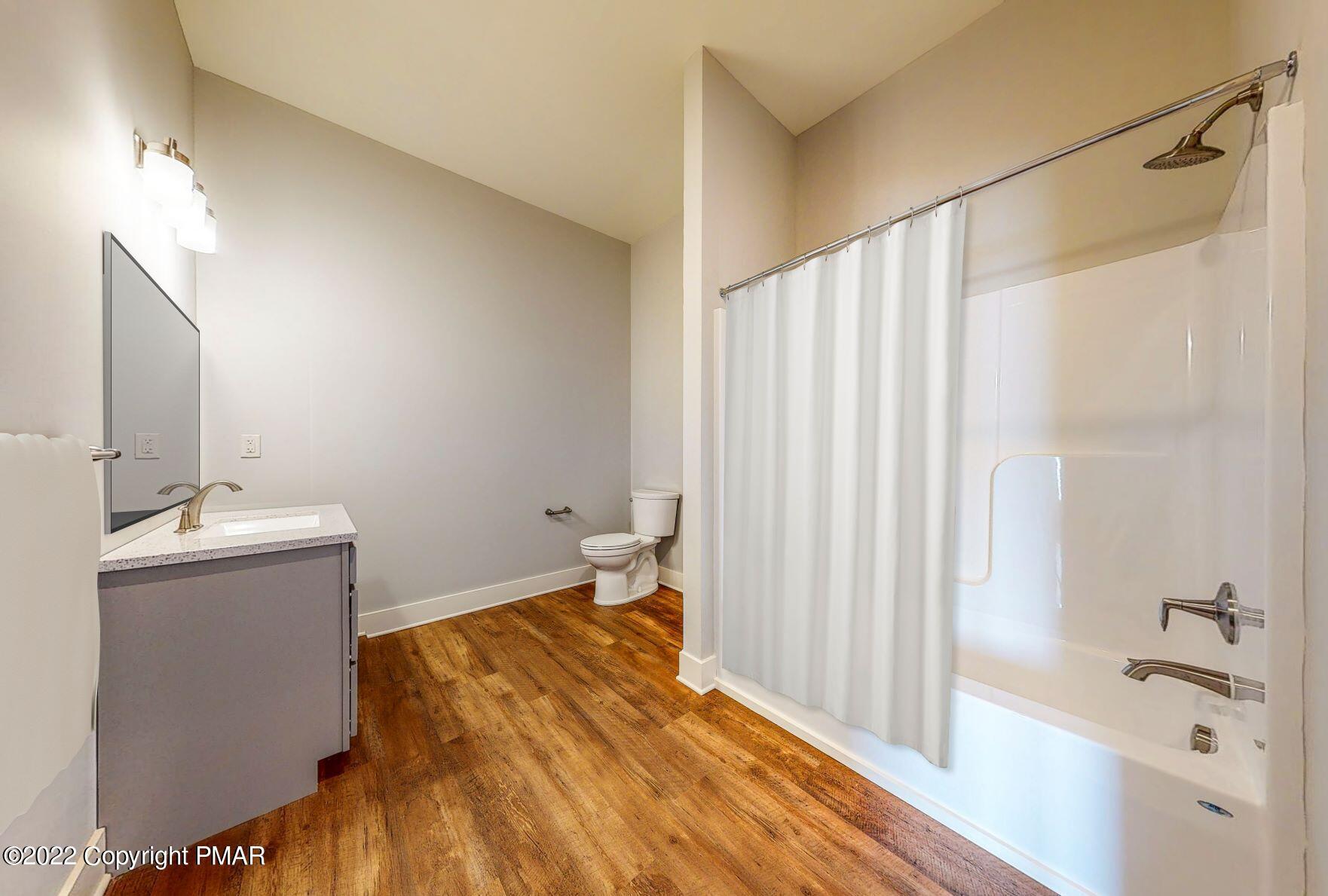 55 North Courtland Street, Unit 204 East Stroudsburg, PA 18301 - Photo 4 of 7 a bathroom with a sink and a bathtub