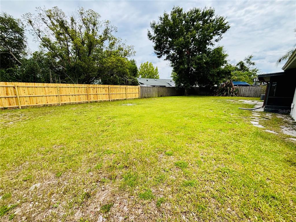 1045 Shaffer Trail Oviedo, FL 32765 - Photo 23 of 30 a view of yard with swimming pool and trees
