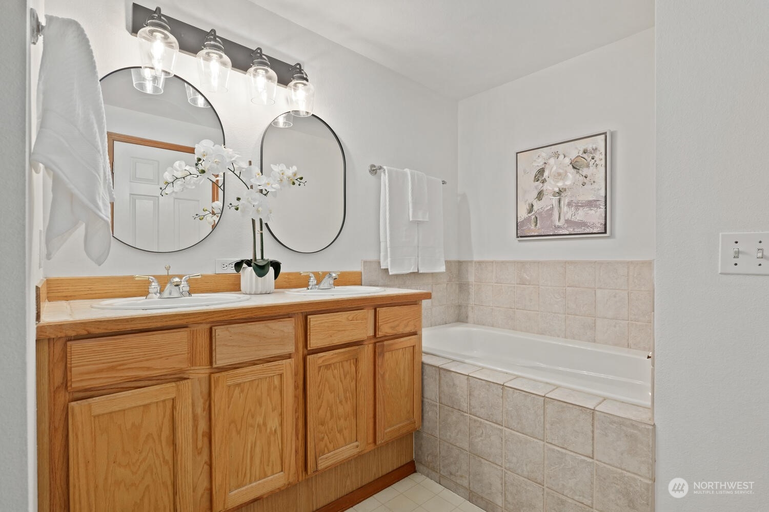1326 238th Place Southwest Bothell, WA 98021 - Photo 20 of 34 a bathroom with a double vanity sink and a mirror