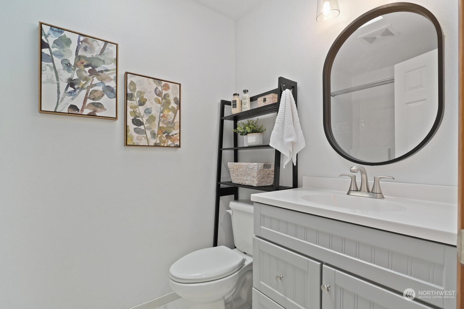 1326 238th Place Southwest Bothell, WA 98021 - Photo 23 of 34 a bathroom with a toilet sink and mirror