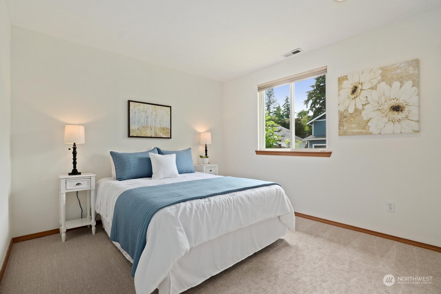 1326 238th Place Southwest Bothell, WA 98021 - Photo 29 of 34 a bedroom with a bed and painting on the wall