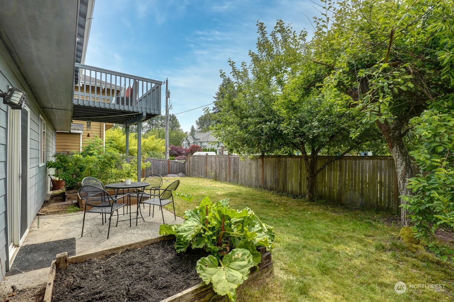 1326 238th Place Southwest Bothell, WA 98021 - Photo 32 of 34 a view of a chair and table in backyard of the house