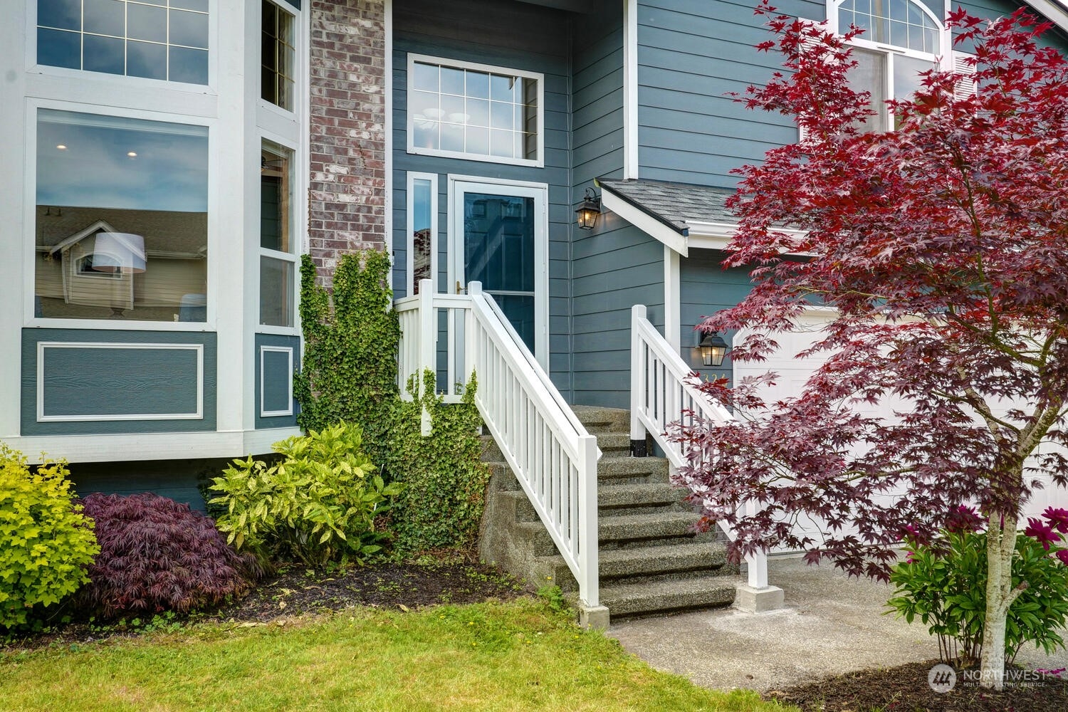 1326 238th Place Southwest Bothell, WA 98021 - Photo 4 of 34 a view of a house with a yard