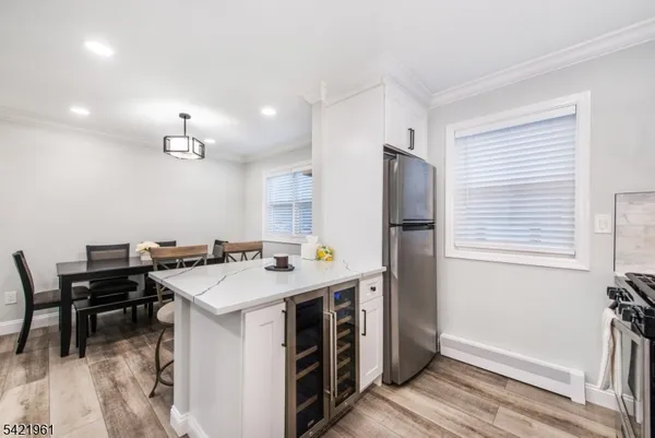 a kitchen that has a table and chairs in it