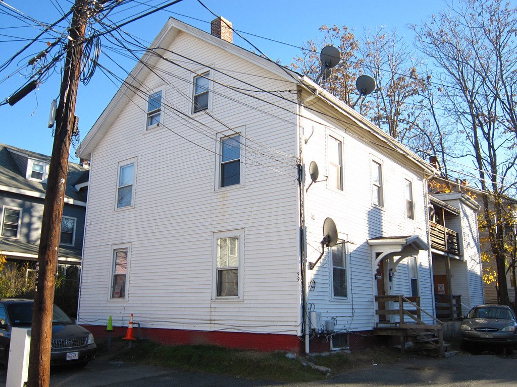 a view of a house with a street