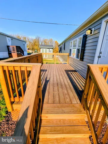 a view of swimming pool with seating area