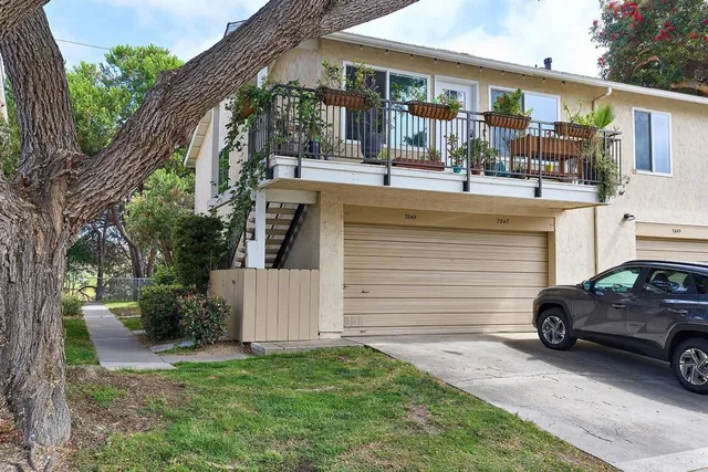 a view of a car park in front of house