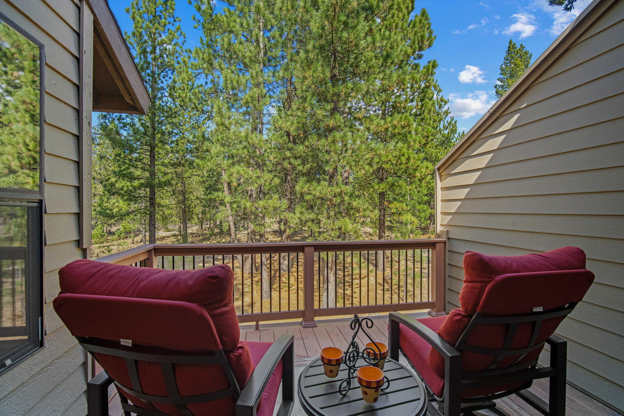 17682 Bittern Lane, Unit 31 Sunriver, OR 97707 - Photo 21 of 44 a balcony with wooden floor and outdoor seating