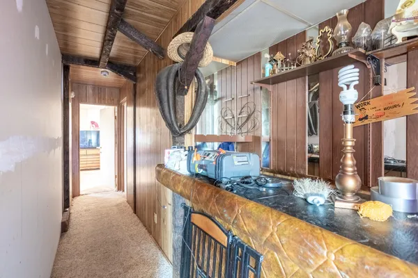 a living room with furniture a flat screen tv and a window